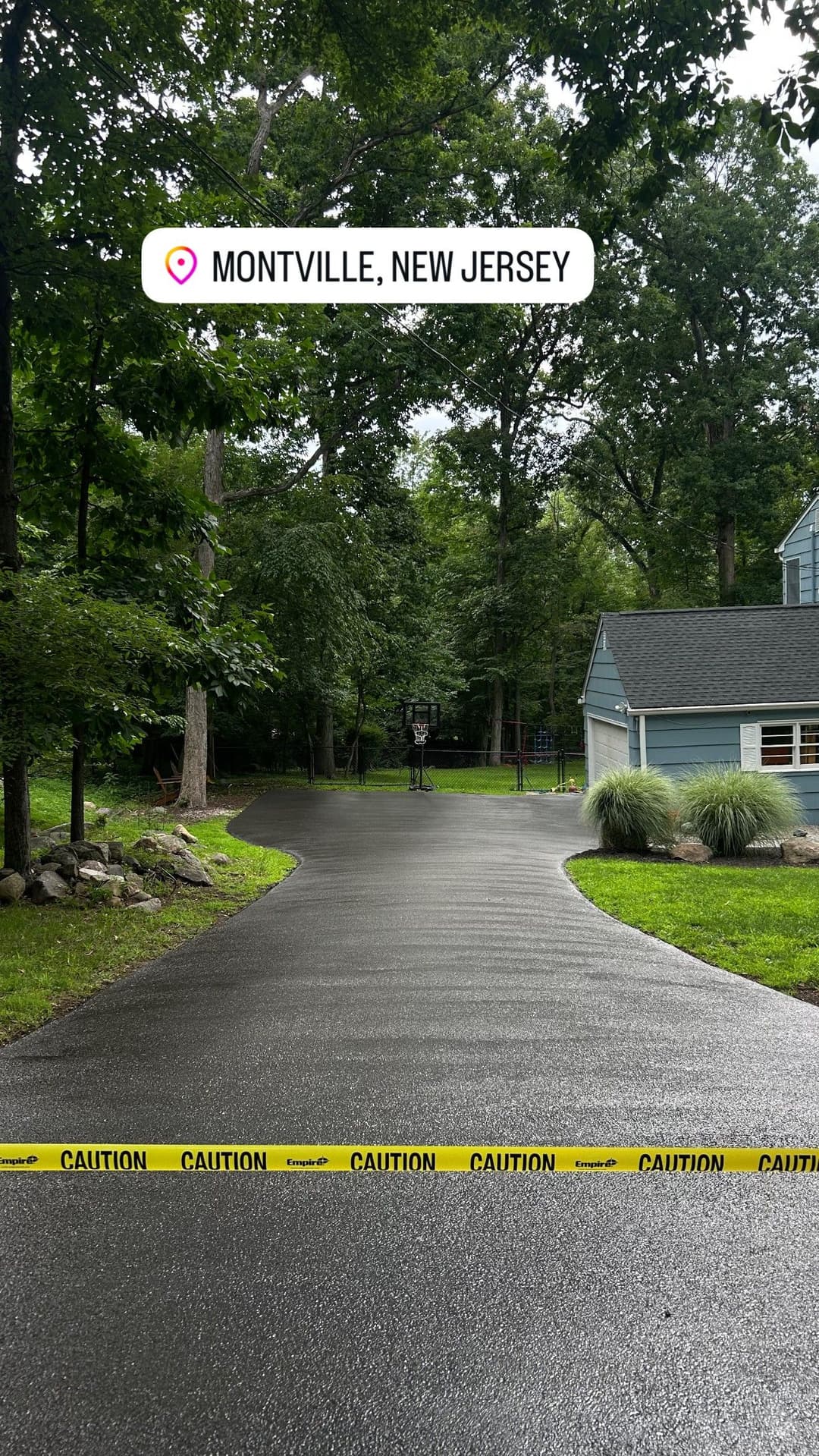 Montville, New Jersey driveway with caution tape, surrounded by trees and a house.